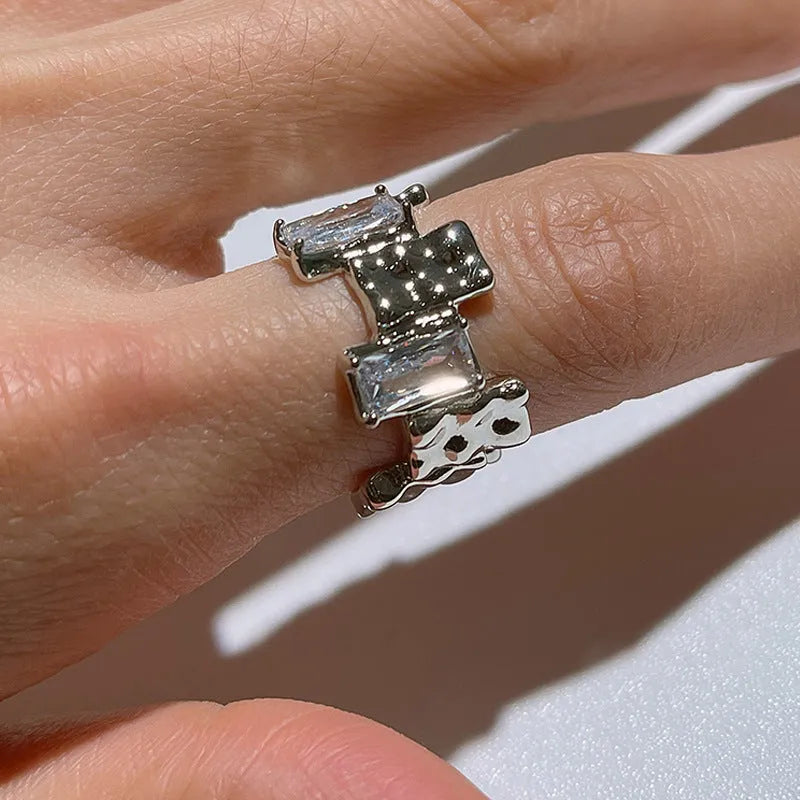 Geometric silver zircon ring with open design and three-dimensional retro decorations
