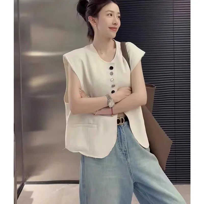Women's loose-fit short-length polyester vest in milky white with side pockets