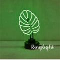Minimalist bamboo-shaped desktop lamp with USB cable and green illumination