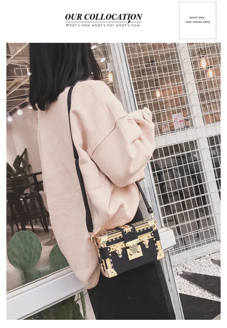 Hard black PU women's shoulder handbag with flap, hasp closure, and decorative rivets.