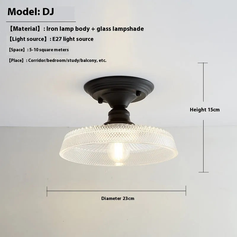 American retro style single-head ceiling or wall lamp with a glass cover.