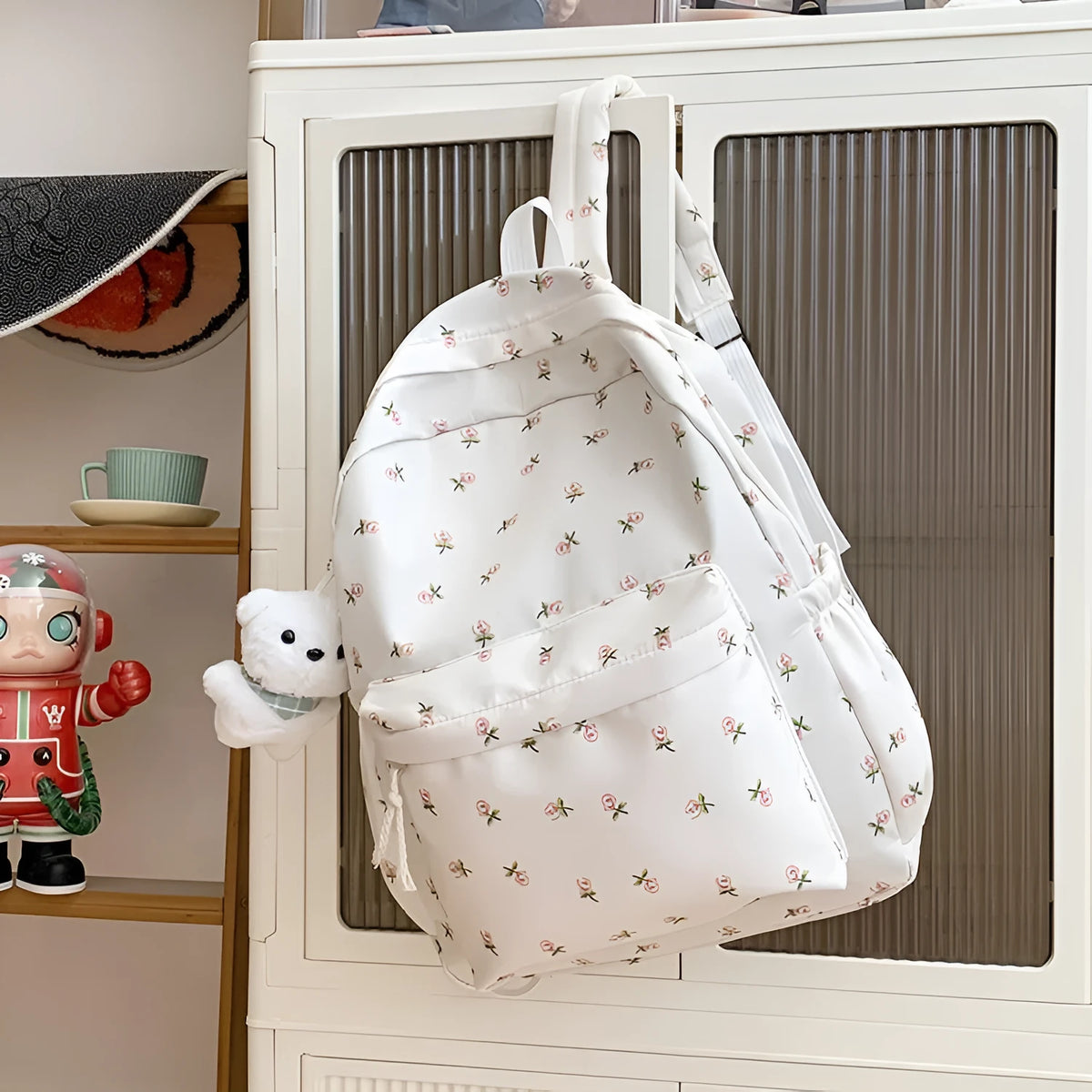 Japanese-style floral print girls' backpack in Oxford cloth with curved shoulder straps, shown in pink floral or white tulip scarf bear.