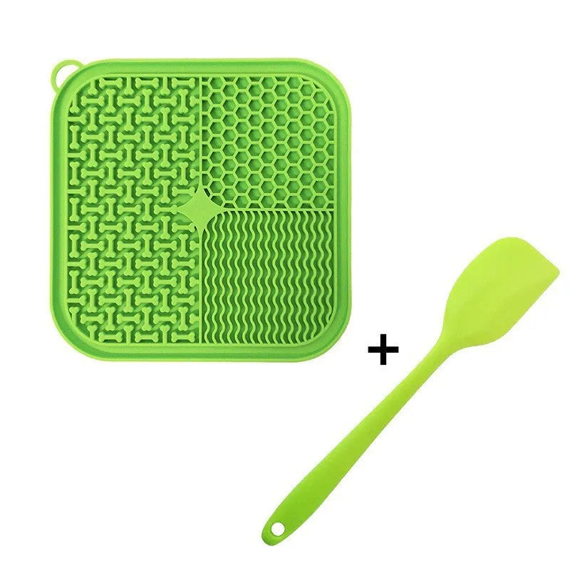 Square orange silicone dog licking mat with textured surface and suction cups on back.