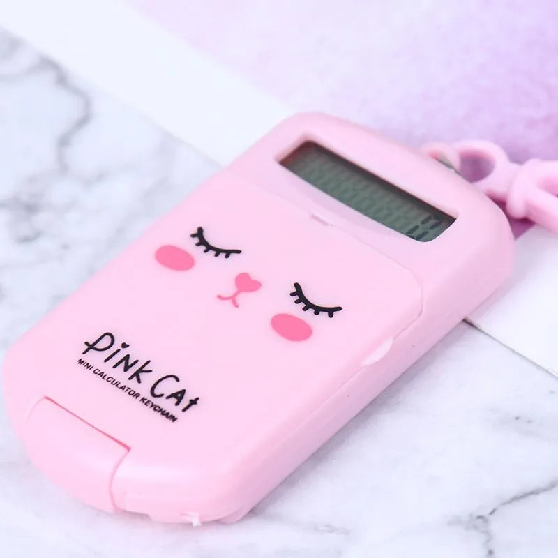 Creative cookie-shaped cute mini calculator with key ring in pink, blue, grey, and black colours