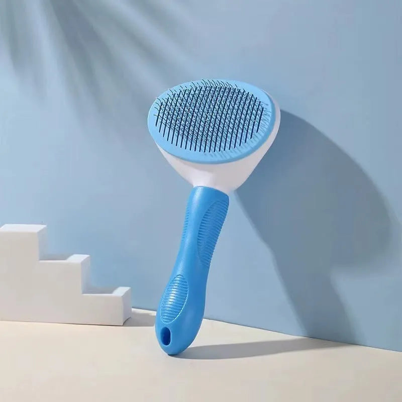 Pet hair removal comb with stainless steel teeth and light blue ABS handle on white background