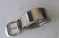 Shiny metallic belt shown in black, gold, and silver for parties and evening wear