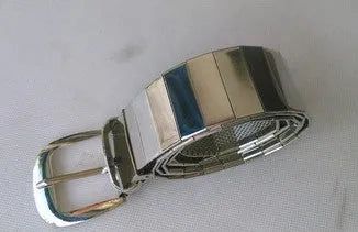 Shiny metallic belt shown in black, gold, and silver for parties and evening wear