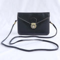 Soft surface crossbody messenger bag with flap closure and lock hardware in wine red colour