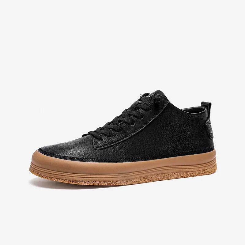 Men's black and white casual leather shoes with round toe and flat rubber sole.