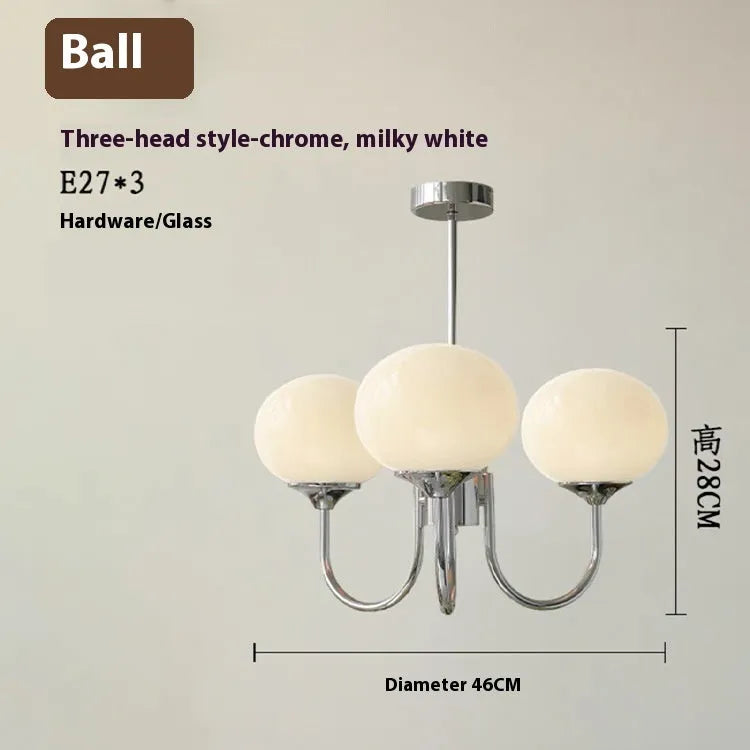 Three-head creative LED chandelier with glass lampshades and iron frame in copper pink finish for living room