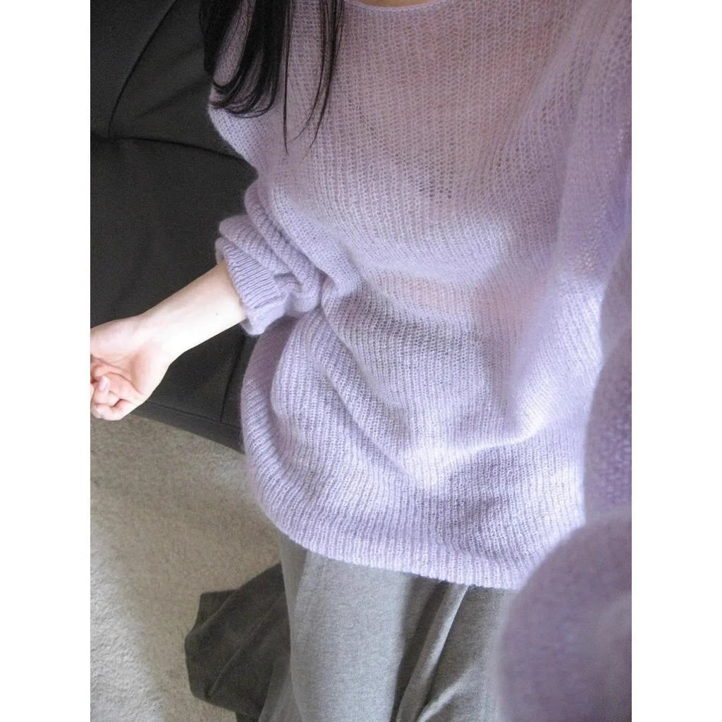 Purple sleeveless women's blouse with princess sleeves and a shoulder strap detail.