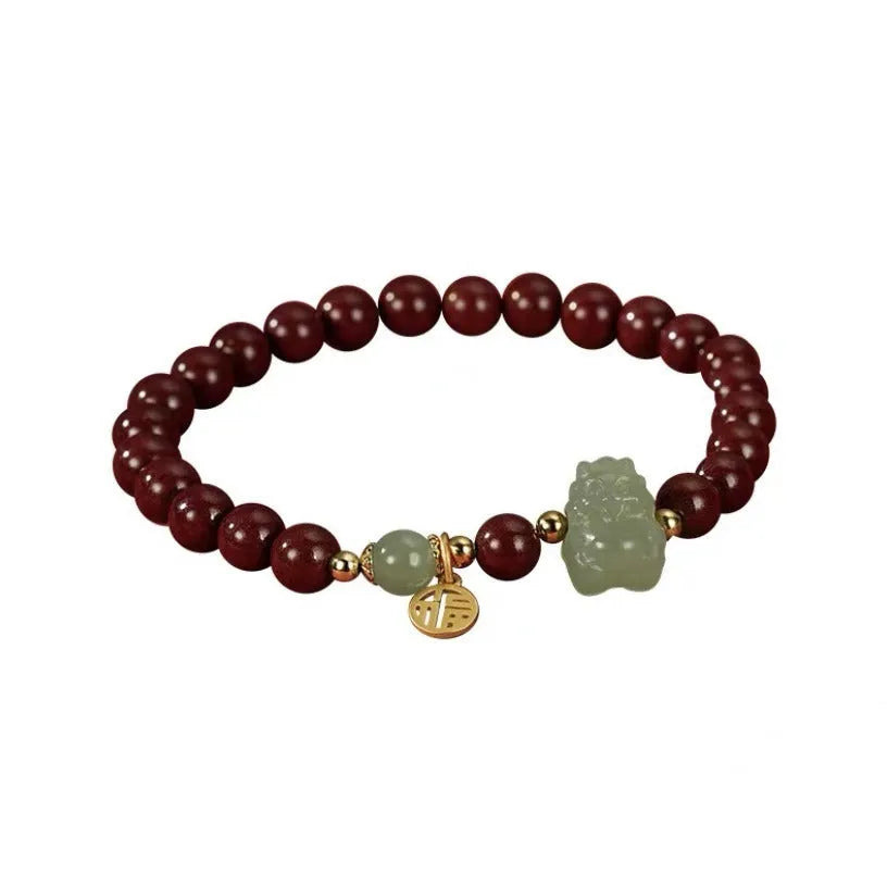 Natural Hetian jade bracelet with 8mm beads showing zodiac motifs in emperor sandstone style