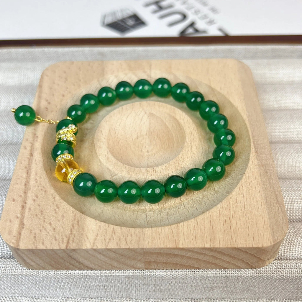 Handmade green chalcedony and red agate beaded bracelet with copper geometric design