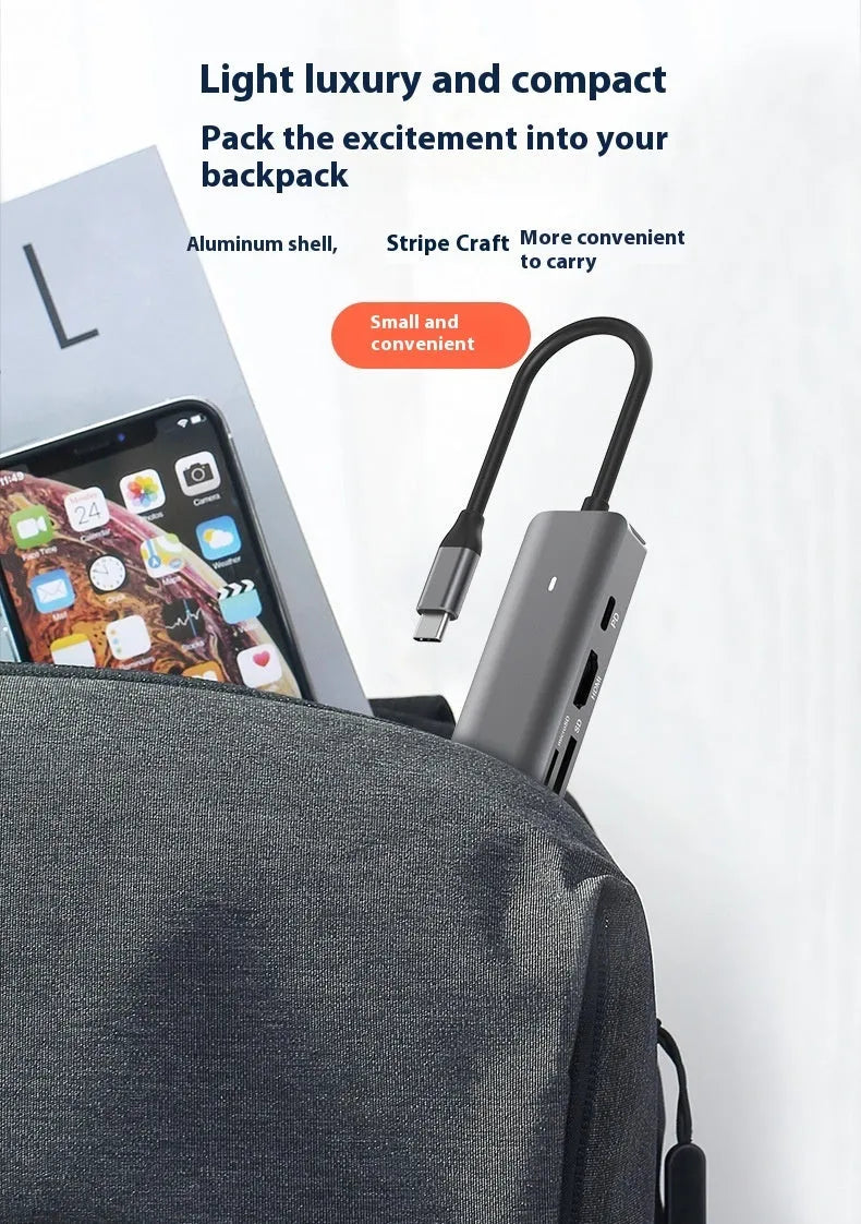 LQT-LH07 7-in-1 USB-C PD computer hub and card reader on a desk.