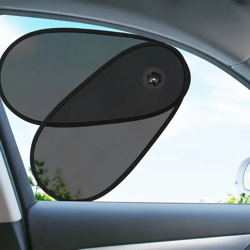 Black breathable car side window sunshade stretched over glass with suction cups.