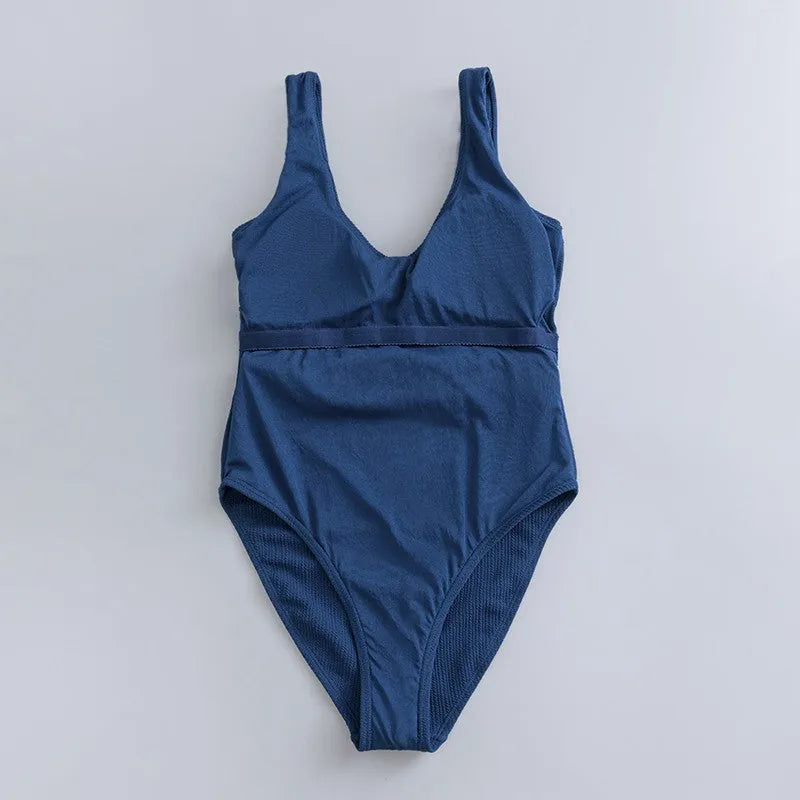 Navy blue women's one-piece swimsuit with triangle neckline and chest pads
