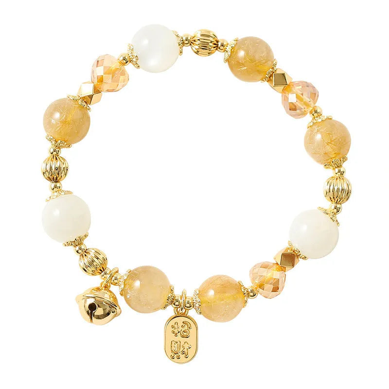 Adjustable gold tone bracelet with rutilated quartz crystal centrepiece and electroplated metal components