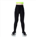 Children's sportswear set showing black and green t-shirts, shorts, and trousers for football and active play.