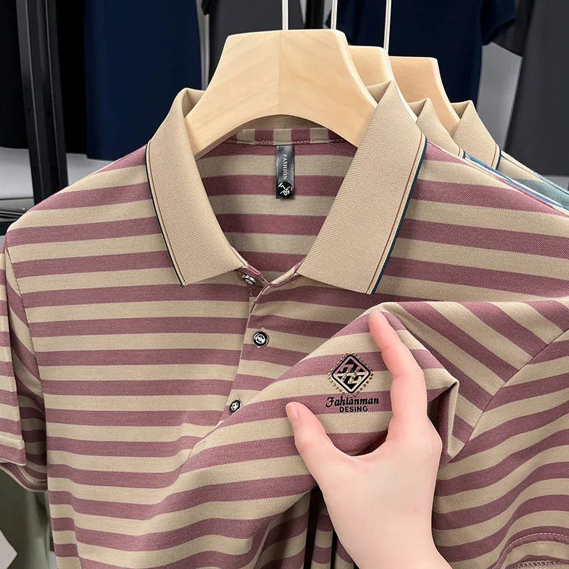 A man wearing a red striped casual short sleeve shirt with mosaic pattern detail.