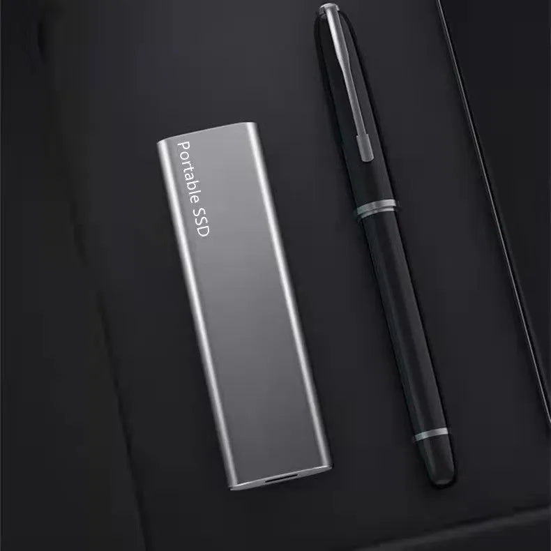 Ultra-thin external mobile solid-state drive with a metal shell, showing red interface connector.