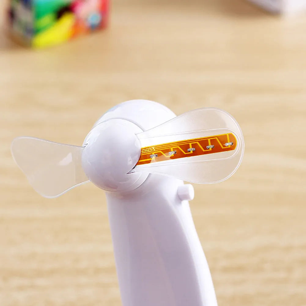 White handheld mini fan with blue and red flashing LED 'I Love You' text display.