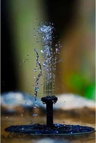 Black solar panel fountain pump with four nozzle heads for garden birdbaths and ponds.