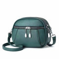 Solid colour small round bag with stitch detailing and zip closure, in multiple colours