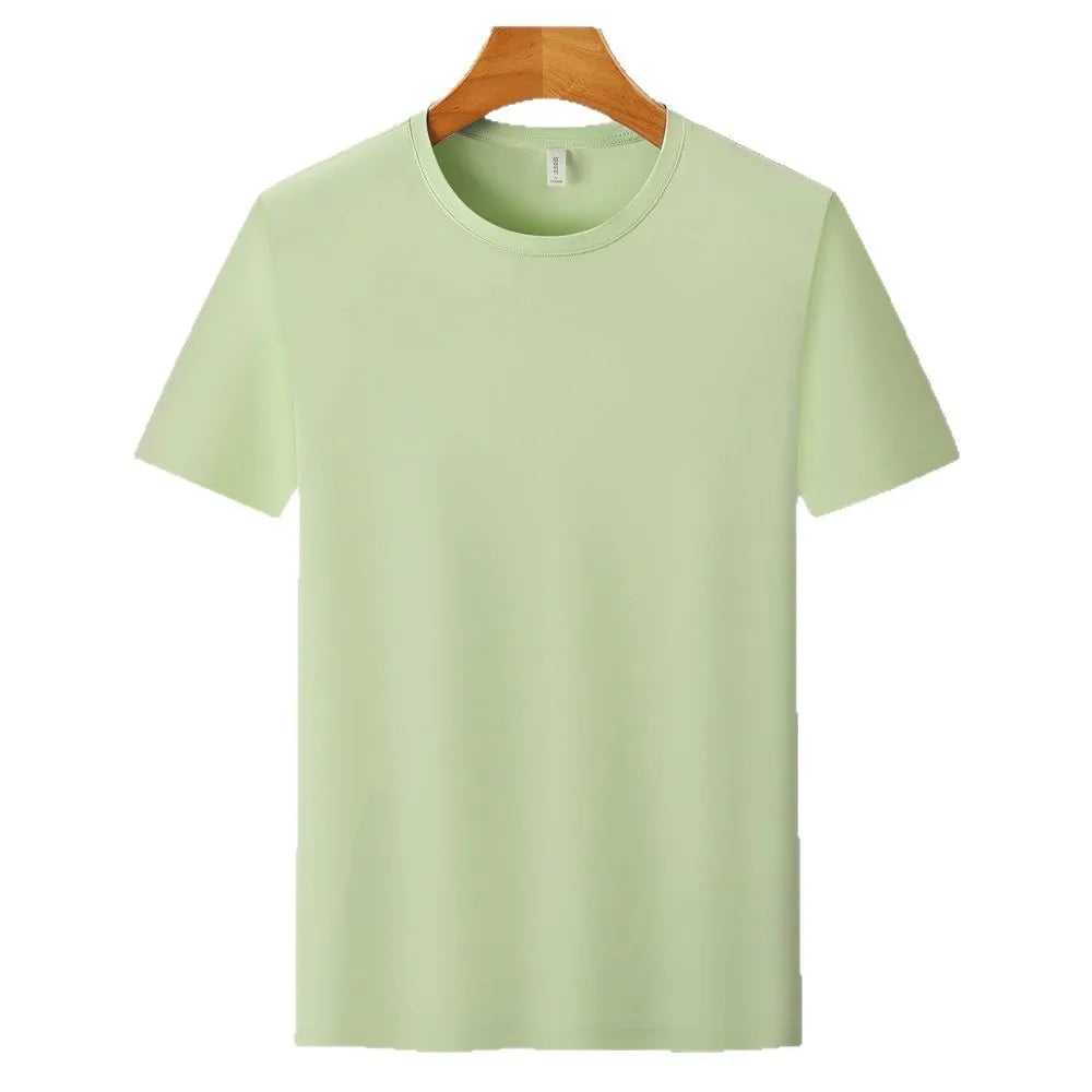 Man wearing a slim fit Ice Silk quick-dry T-shirt in apple green, showing short sleeves and casual style.