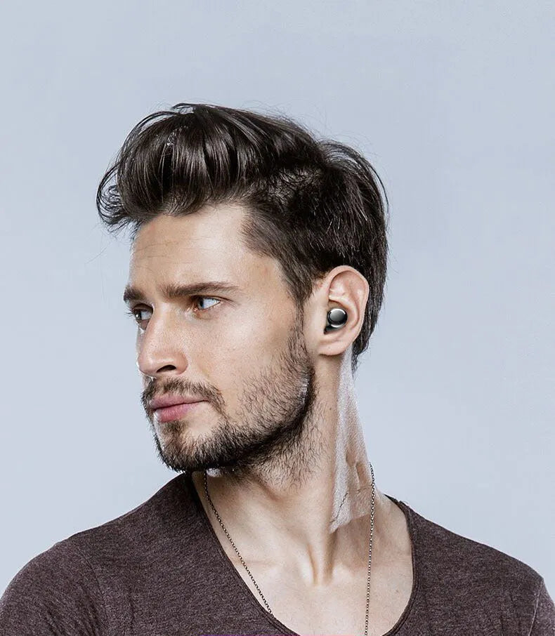 Wireless Bluetooth headset earbud in black with battery display