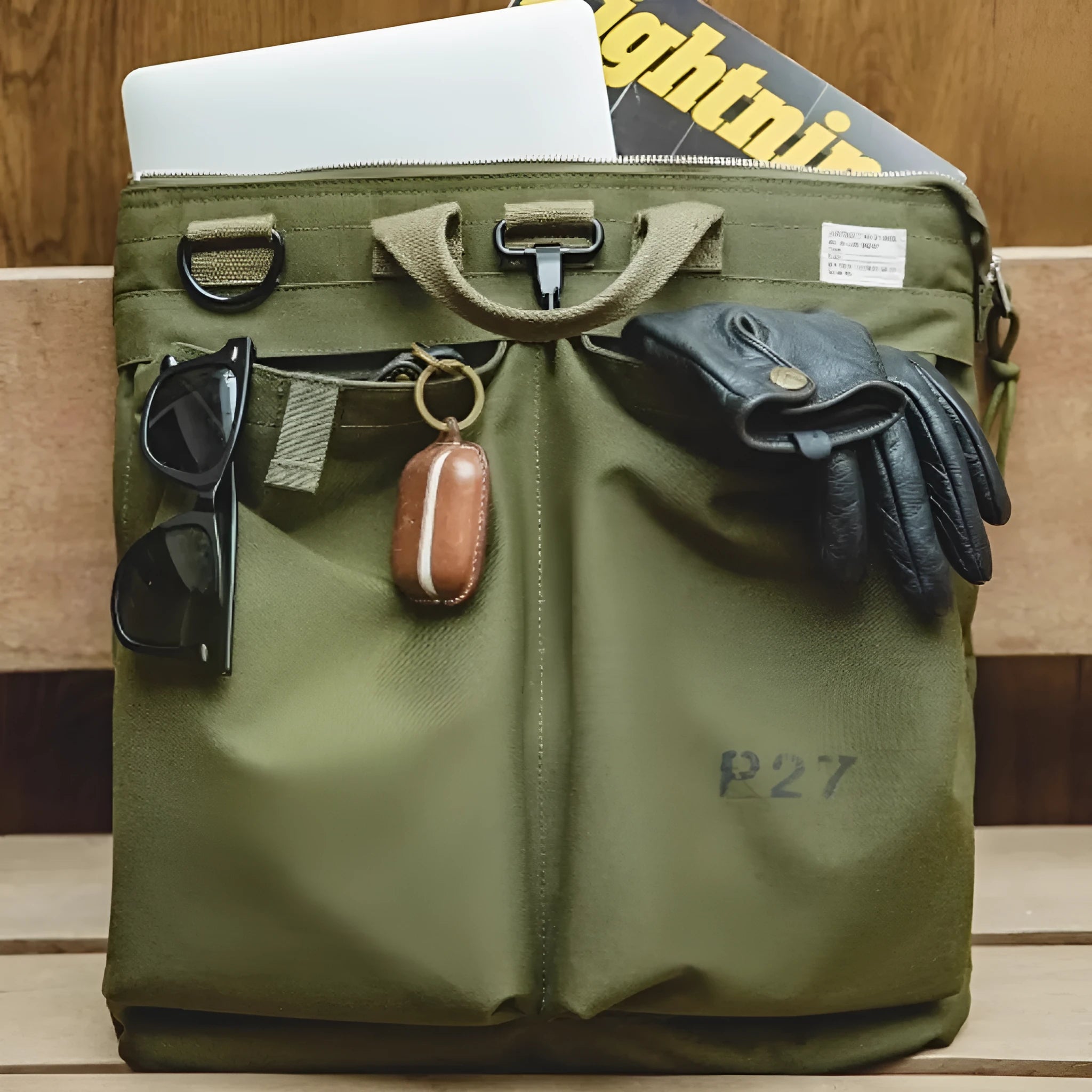 Canvas crossbody messenger bag in retro style with shoulder strap, showing internal phone pocket and 15-inch laptop capacity