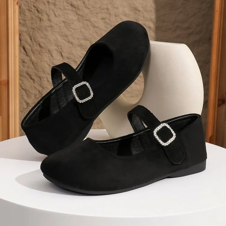 Black canvas fisherman shoes with low-top design and rubber soles