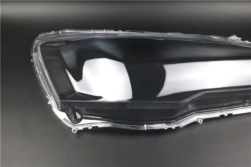 Transparent plastic car headlight housing cover showing 50mm by 30mm dimensions