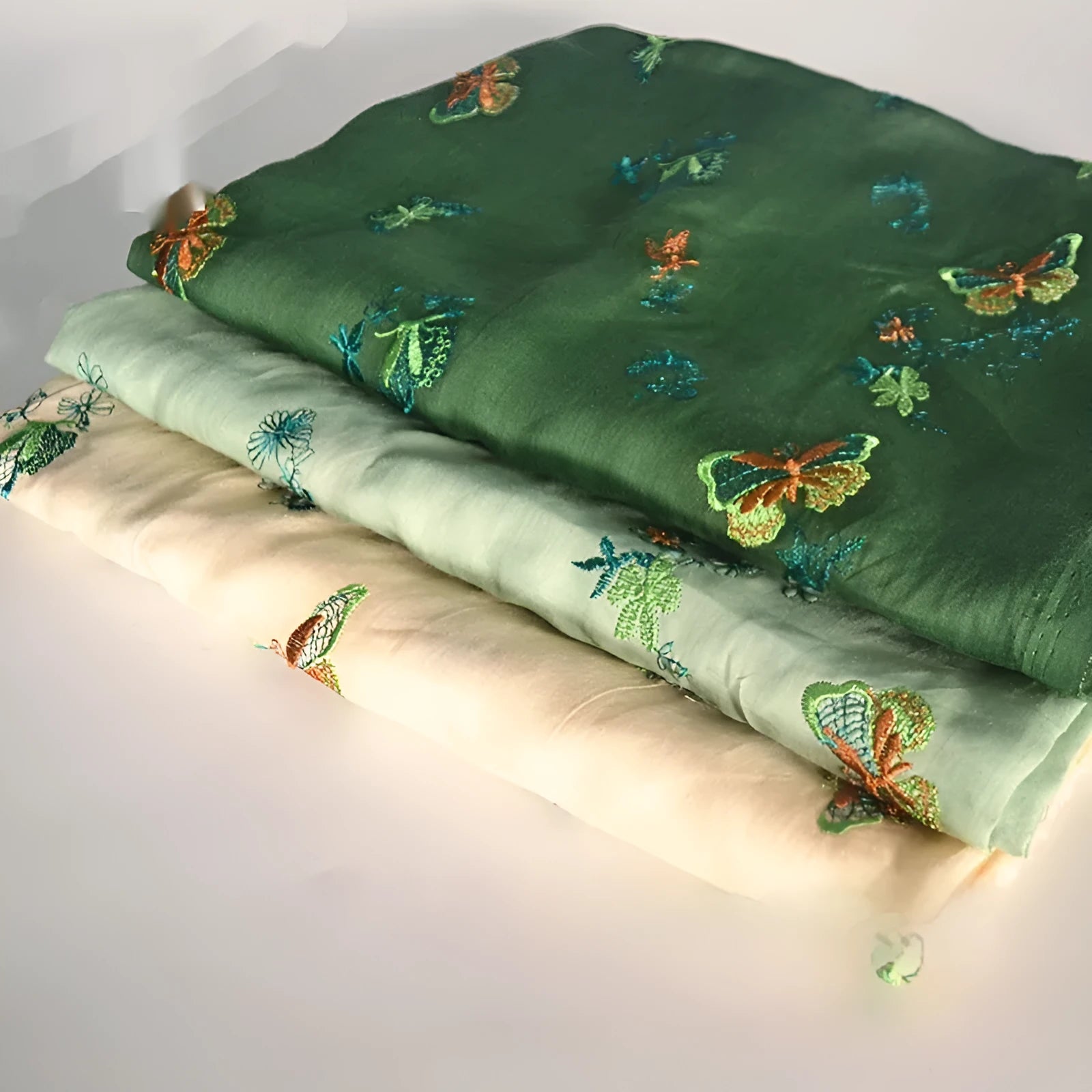 A piece of pure ramie fabric in a choice of beige, grass green, or dark green, shown with a ruler indicating its 140cm width.