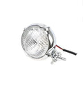 Black retro-style Harley motorcycle headlight with an 8cm diameter cast aluminium housing.