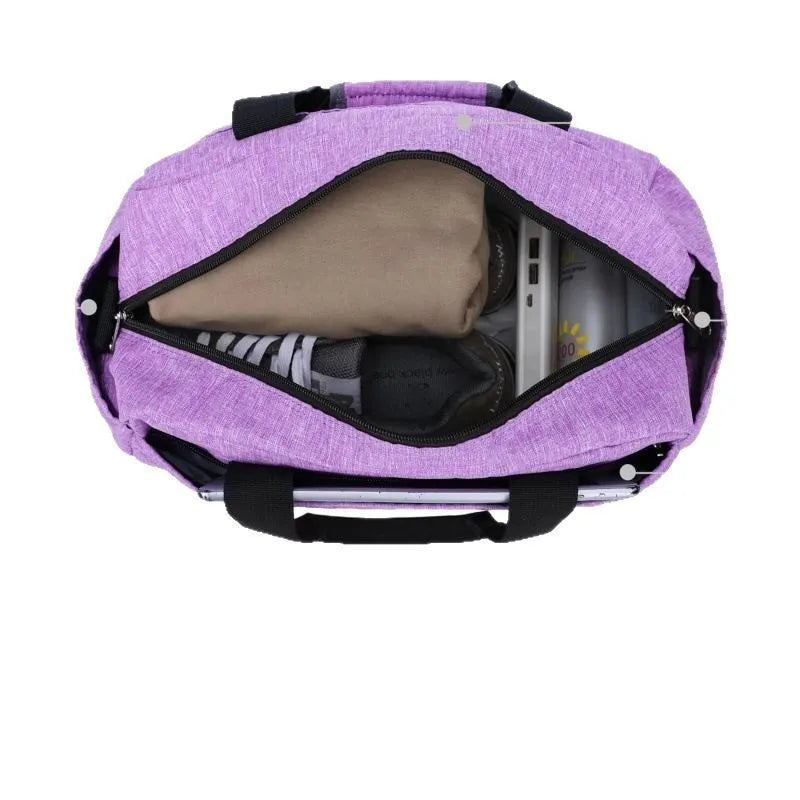 Small polyester portable luggage bag in grey with curved shoulder strap on white background