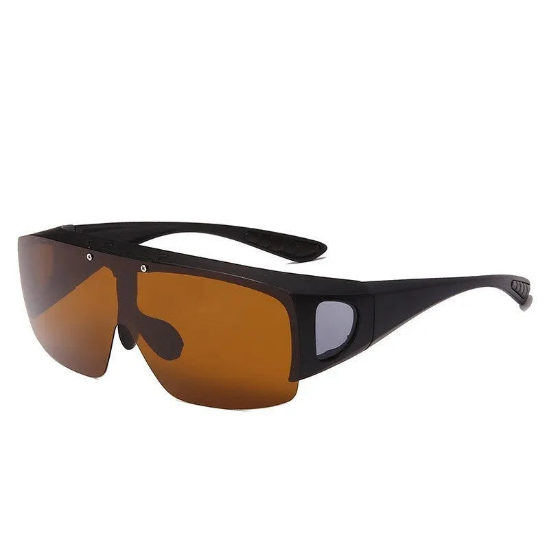 One-piece polarised sunglasses with myopia correction and multiple interchangeable coloured lens sheets laid out.
