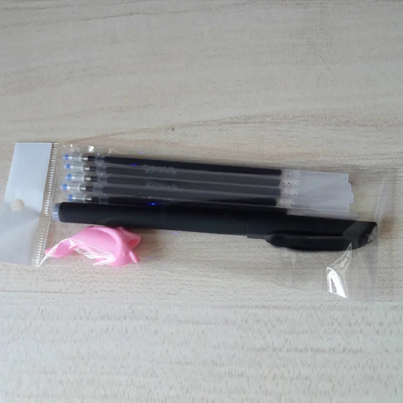 Automatic fade and disappear pen set showing pen holder, case, and eight refill cartridges of vanishing ink