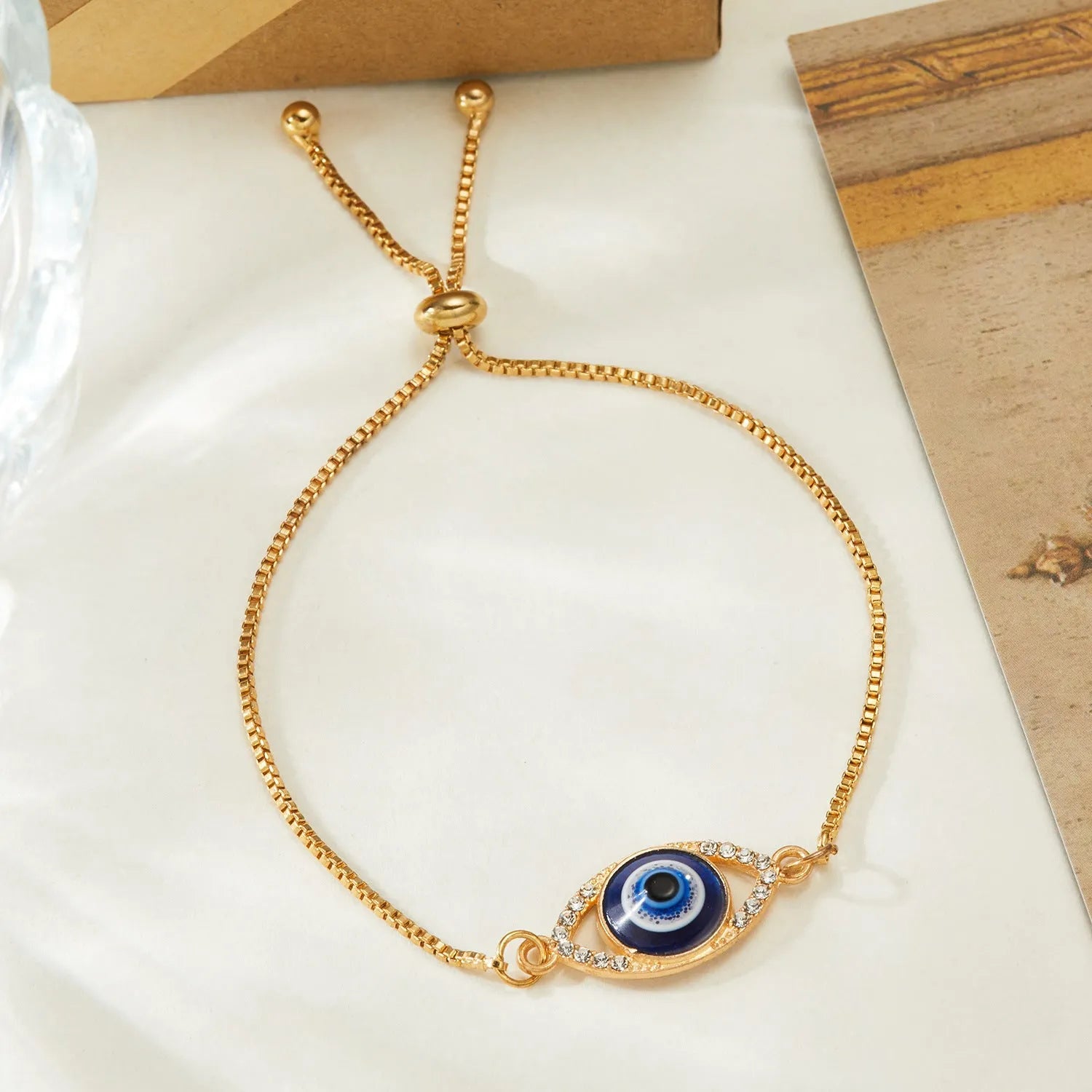 Silver hollow metal adjustable chain bracelet with devil eye and point diamond motif gothic style