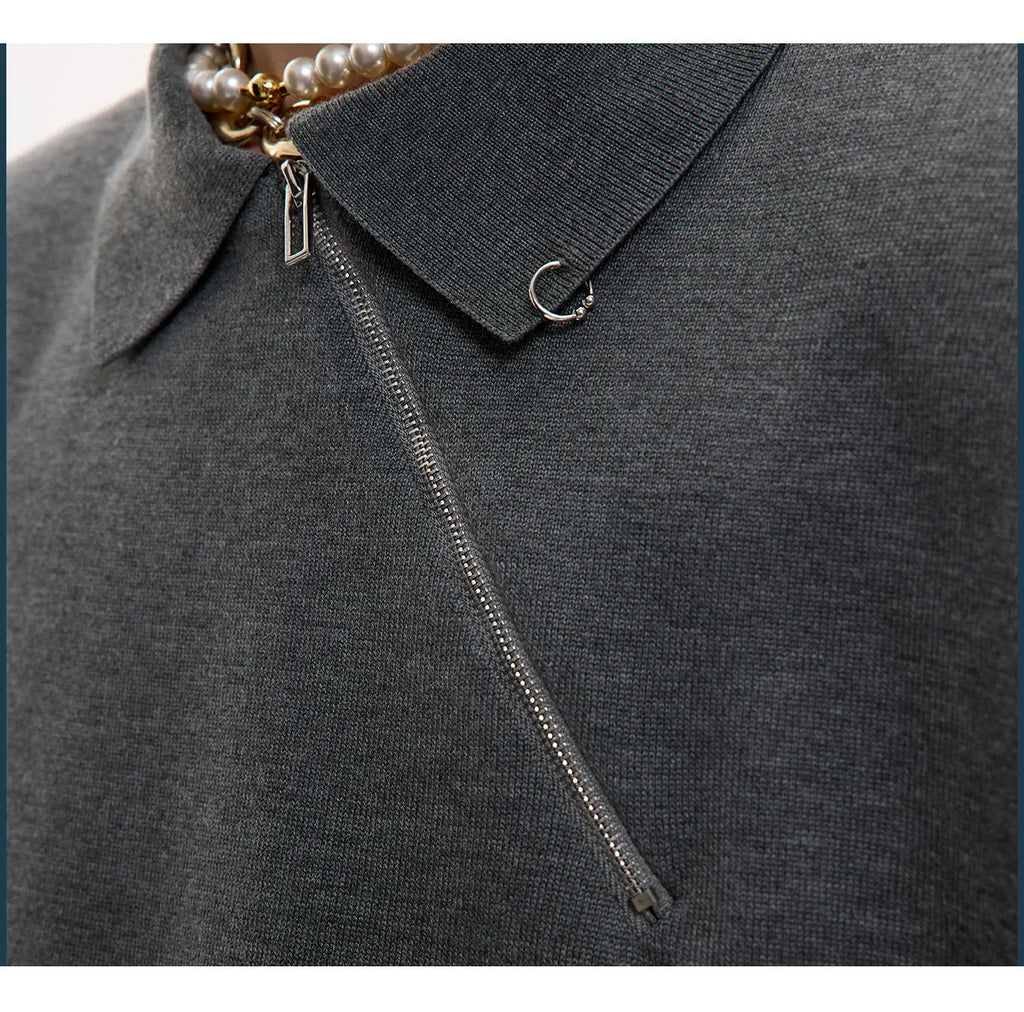 Men's black slim-fit knitted polo shirt with an oblique diagonal zipper on the lapel collar.