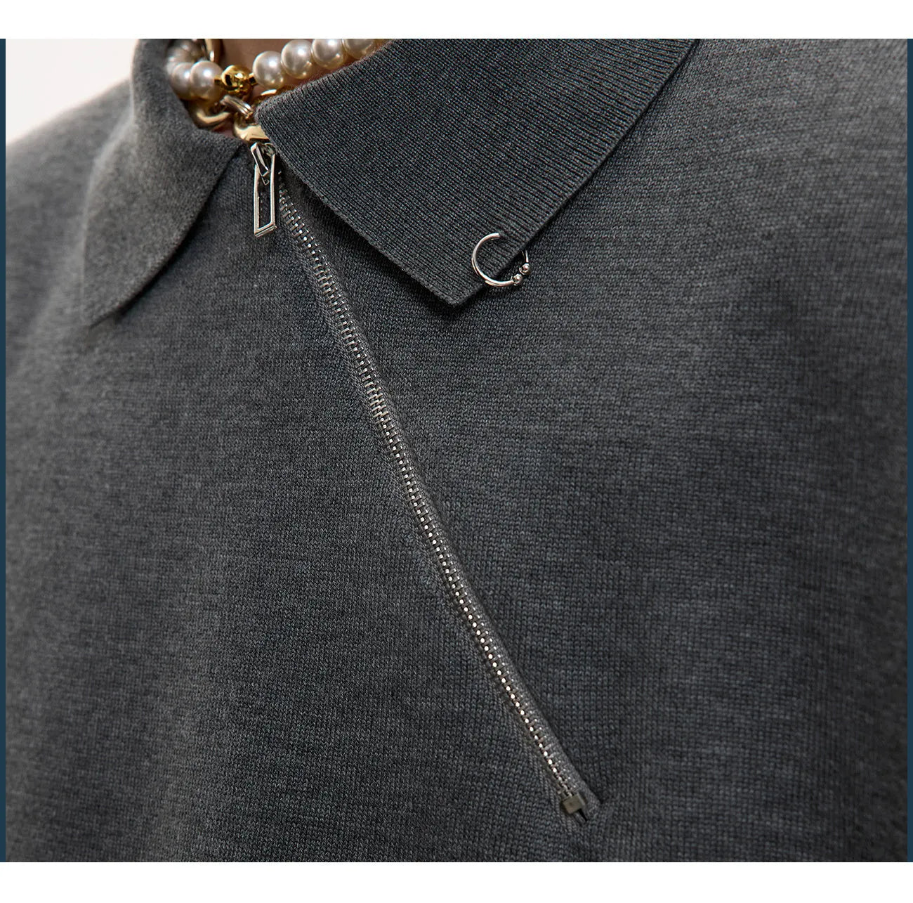Men's black slim-fit knitted polo shirt with an oblique diagonal zipper on the lapel collar.