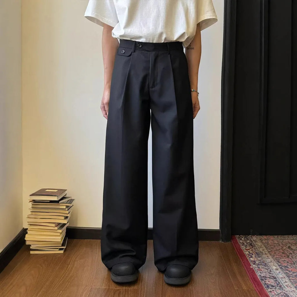 Men's straight-leg wide-leg casual trousers in black, showing loose fit and draping fabric.
