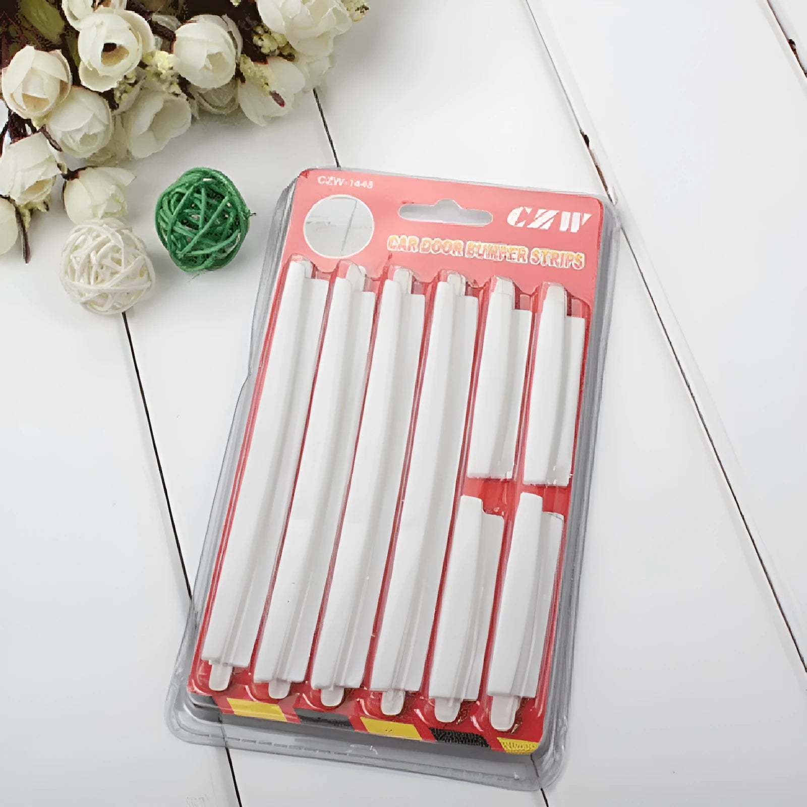 White plastic car door side bumper strip set for scratch protection.