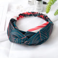 Red cloth headband with banana leaf pattern for women, showing elastic band construction