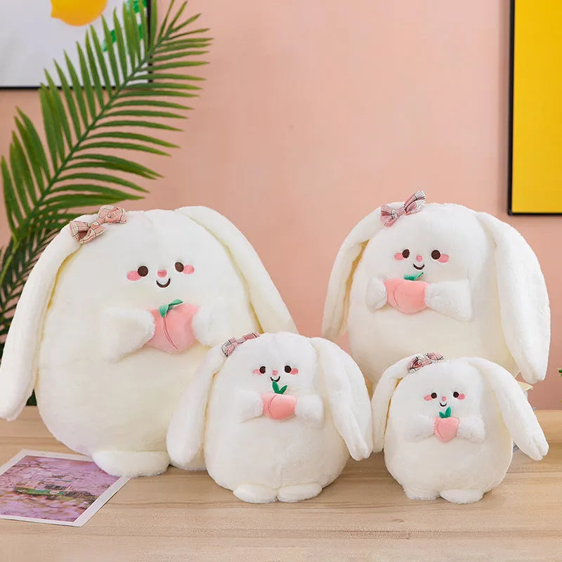 Rabbit peach plush toy in 20cm, 25cm, 35cm and 45cm heights on a plain background