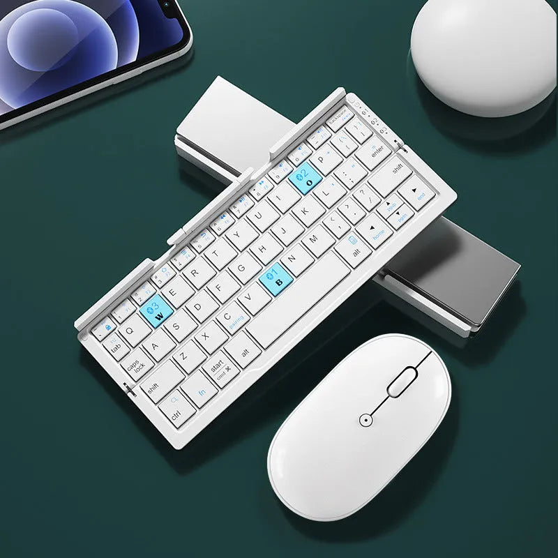 Silver and black grey foldable Bluetooth keyboard open with stand holding a mobile phone