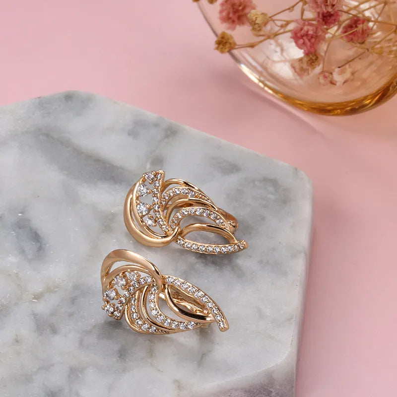 Gold geometric wing ear clips with micro-inlaid zircon stones on U-shaped copper clips