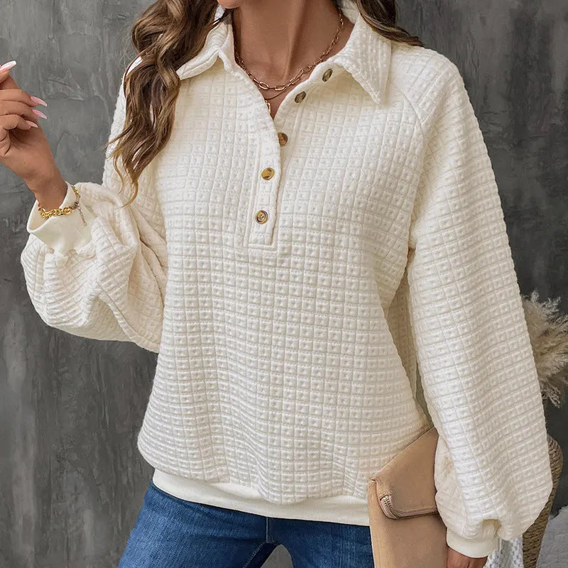 Women's beige thick polo collar long sleeve sweater laid flat.