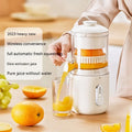 Fresh green portable wireless electric juicer with USB charging port on a kitchen counter.