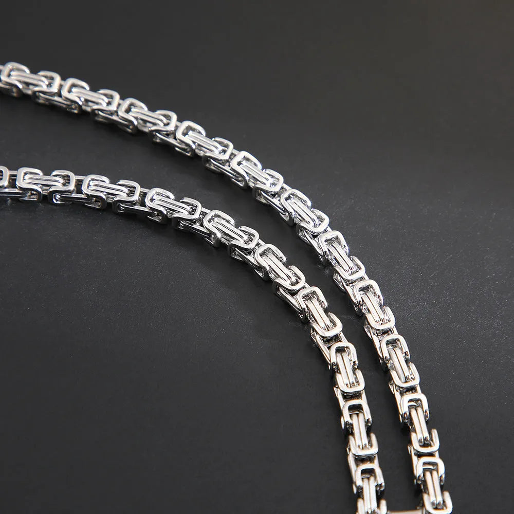 Men's titanium steel geometric water ripple pendant necklace on adjustable emperor chain in black, gold, or silver finish.