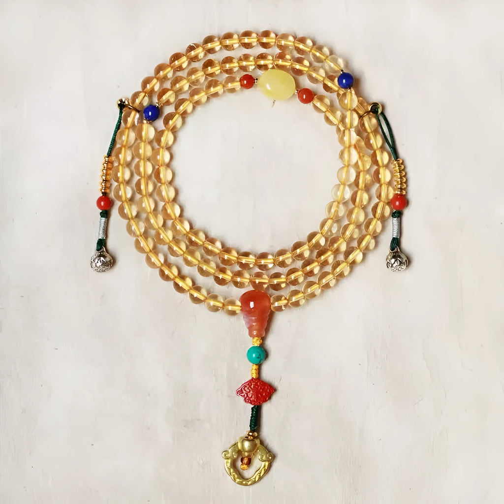 Yellow natural Brazilian citrine bracelet with 1mm beads and filament fastening on a wrist.